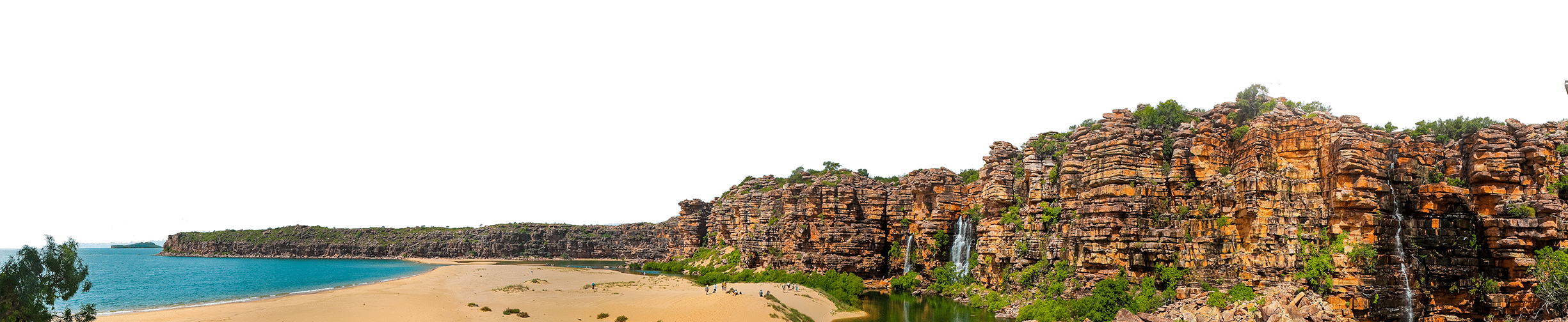 Panoramic view of a coastal travel destination featuring sandy beaches, clear blue water, and rugged cliffs with vegetation.
