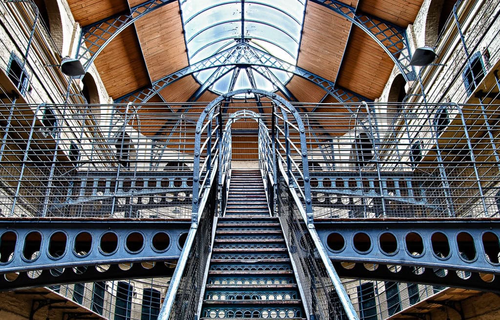 Explore the interior of this historic Dublin landmark, featuring a majestic central staircase with intricate metal railings and an arched glass ceiling. A must-see on your travel itinerary, it's among the top things to do when visiting this enchanting city.